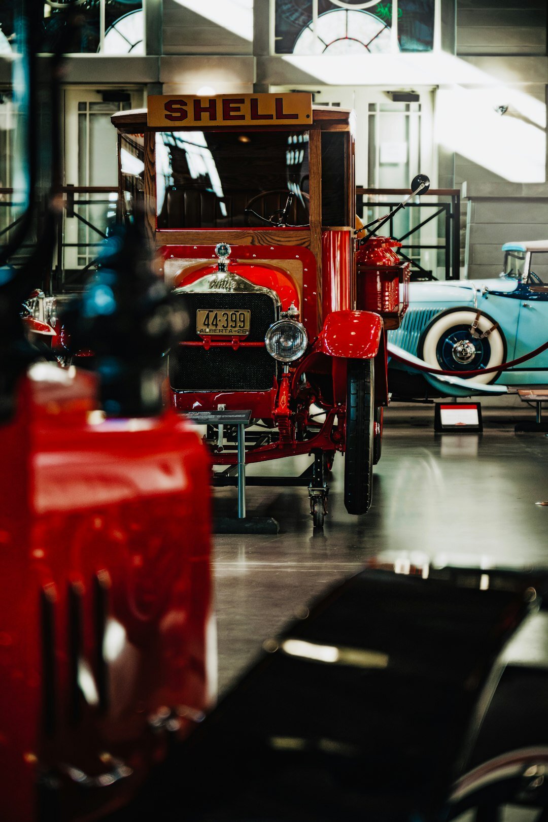 Interior of a classic car museum with restored vintage automobiles