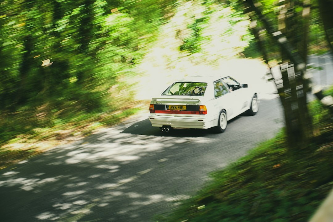 Line of vintage rally cars parked on a rural Uruguayan road