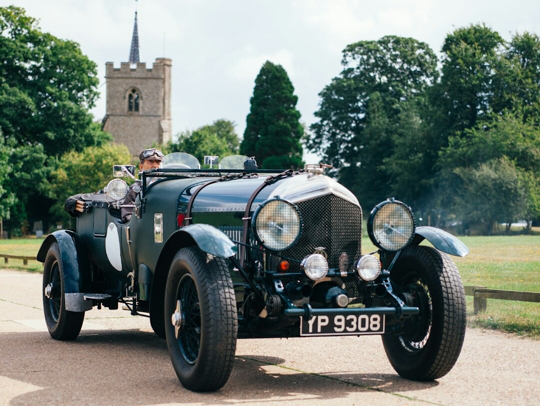 Elegant classic car auction hall with a spotlighted vintage automobile
